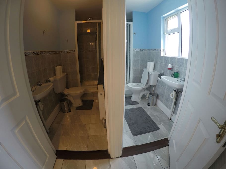 two bathrooms with shower