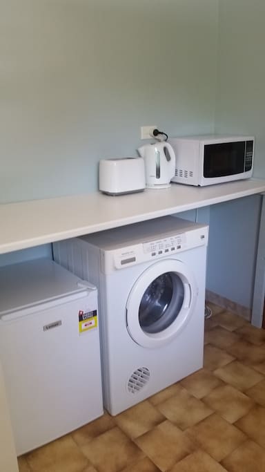 Private kitchenette with bar fridge, microwave, electric kettle, toaster, plates, cups, utensils