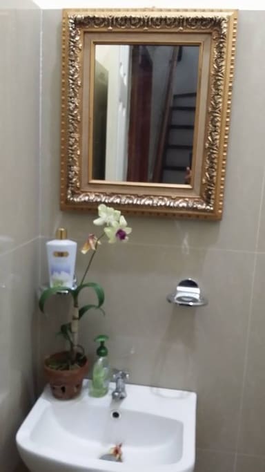 Private bathroom with sink, toilet and shower.