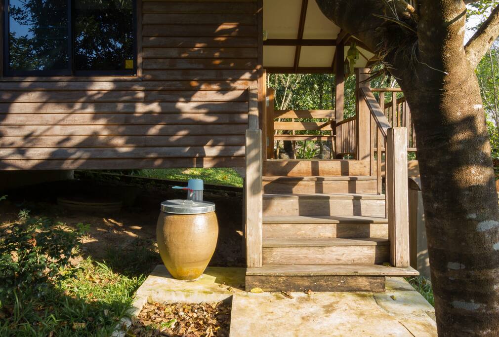 Thai style entrance - Thai house usually has a water jar in front of the house for wash the feet before entering the house. In some places, we can drink also.