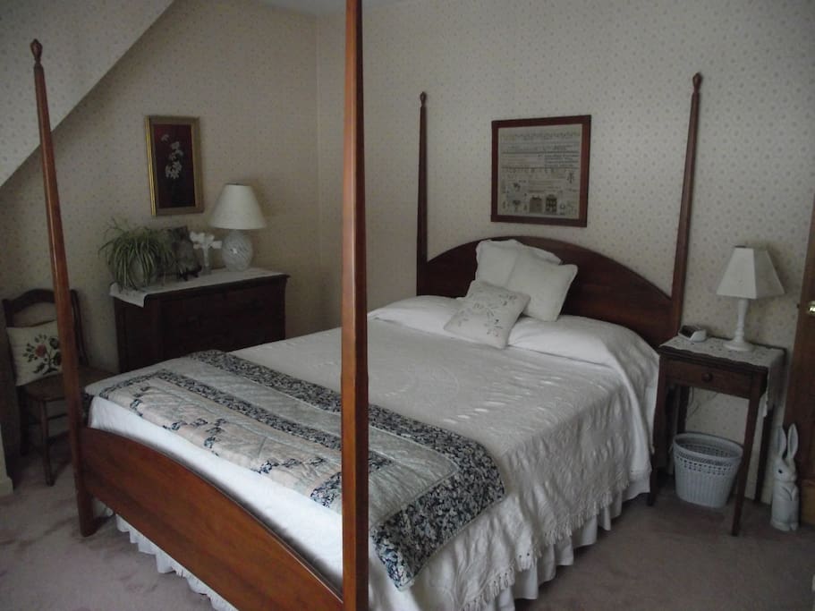 Bright bedroom with queen bed.