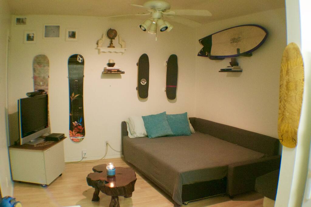 Living Room; couch pulls out into full size bed and equipped with bedding
