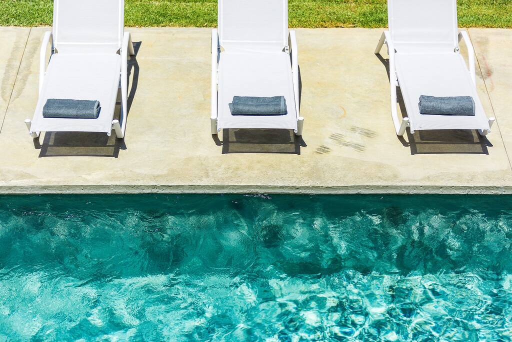 Sun beds by the pool