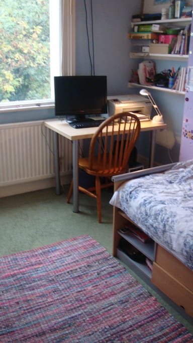 Bedroom with computer available for guests