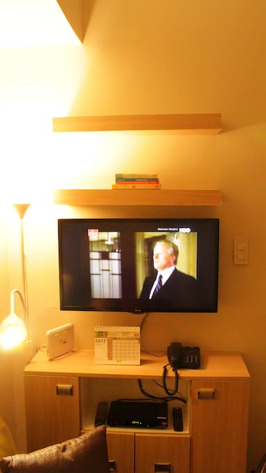 A smart TV mounted on the wall.