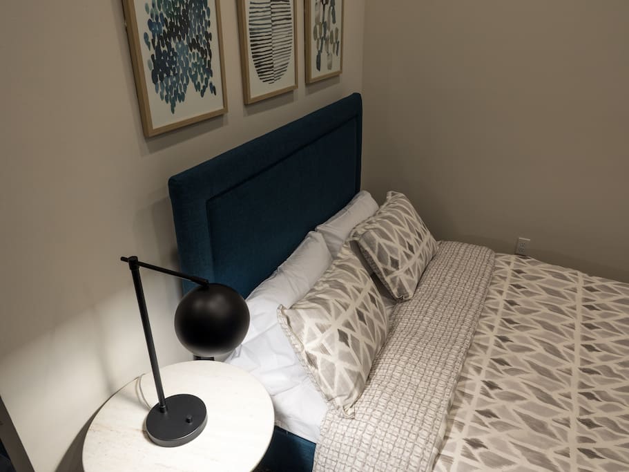 Bed and nightstand with lamp