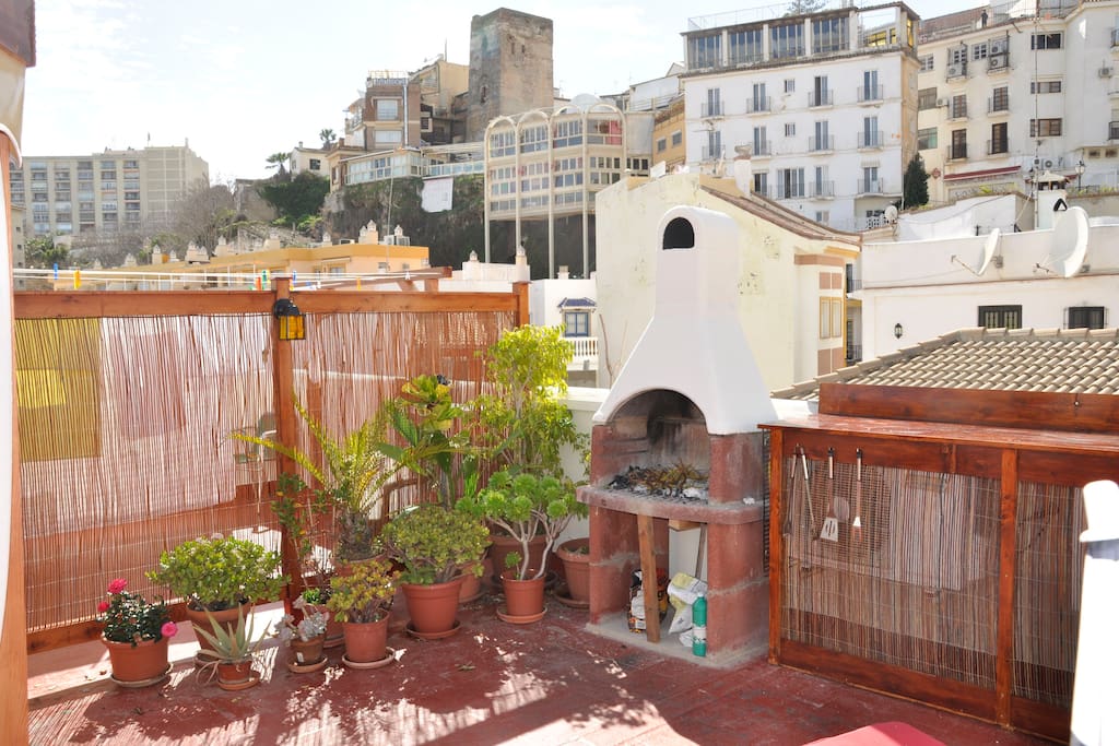 BBQ and fireplace on the roof terrace