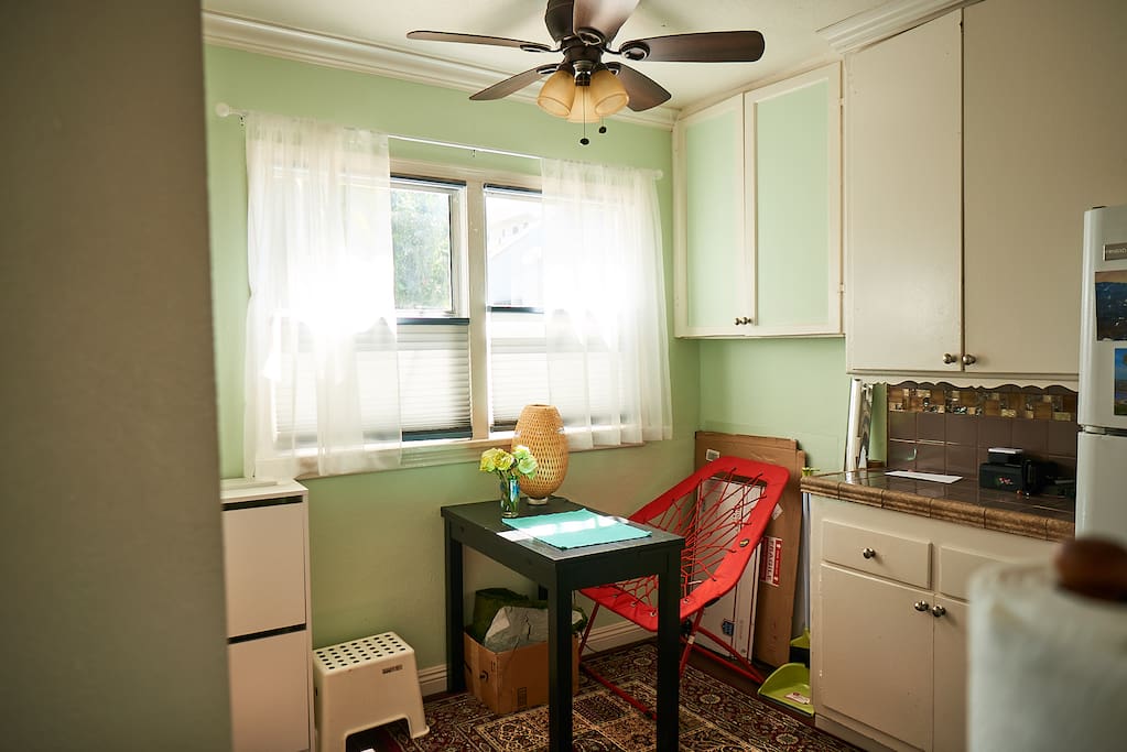 Another view of kitchen table. The red chair is bange type. The ropes are rubber and stretch when you sit.