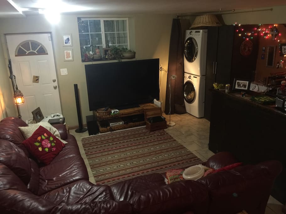 Downstairs family room with playroom, washer/dryer