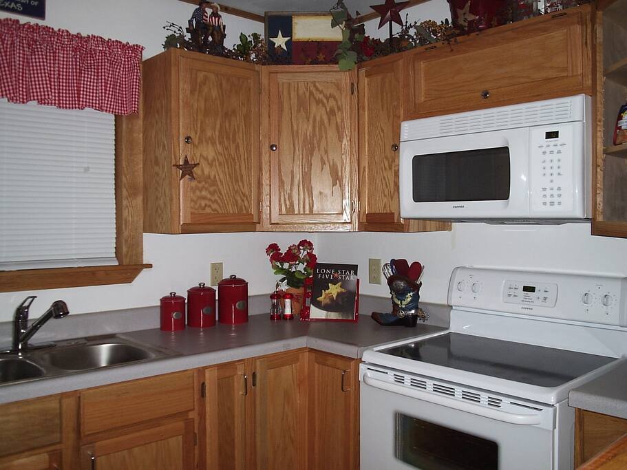 Full kitchen with cooking utensils