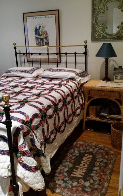 Cozy antique queen iron bed