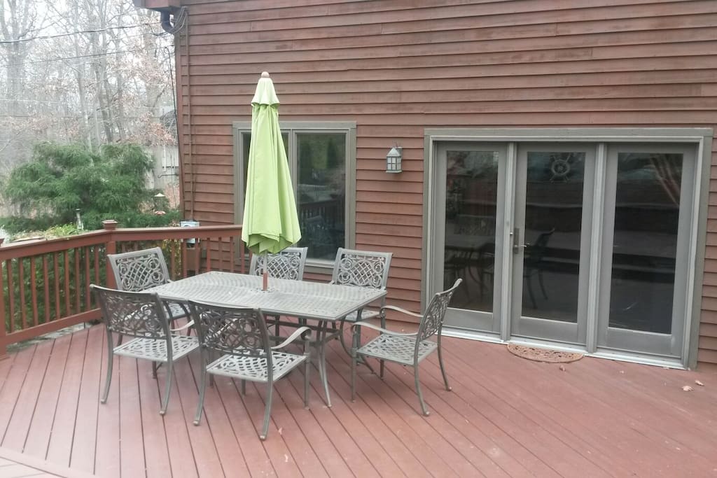 Table for six on the deck with umbrella