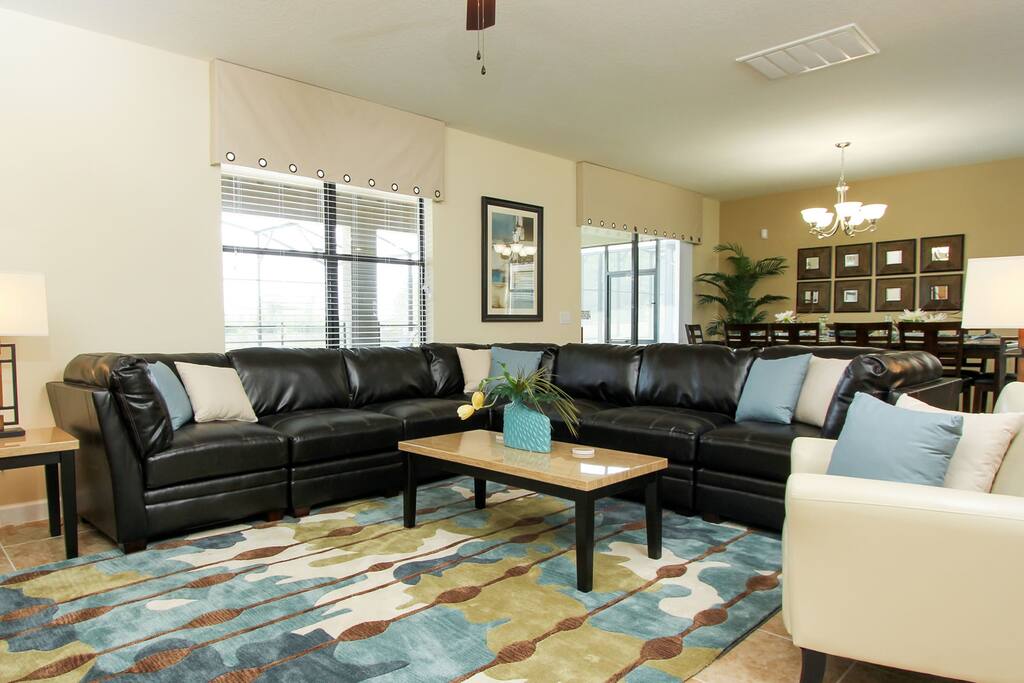 Comfortable living room with sectional sofa and flat screen TV