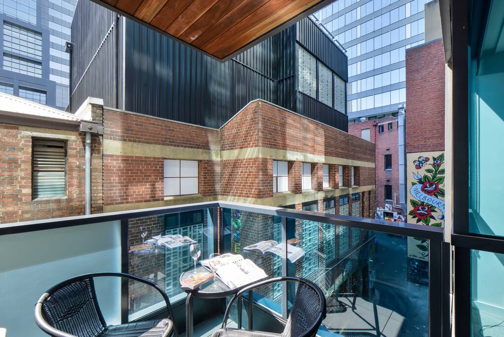 Relax on the private balcony with a book and a drink.