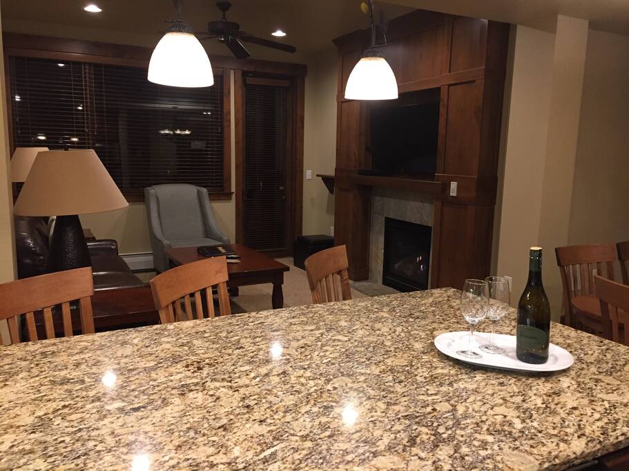 Living room - fireplace and kitchen bar