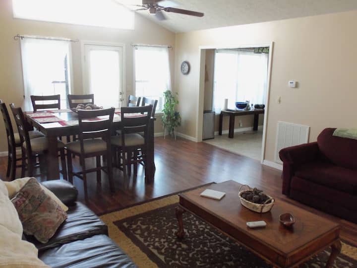 Living room and dining room.  Table seats 8.  Pull out sofa-bed.