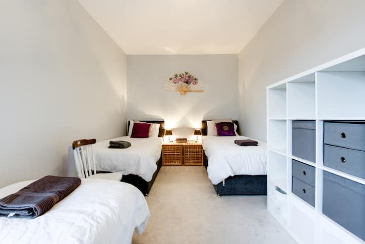 Habitación triple con tres camas individuales