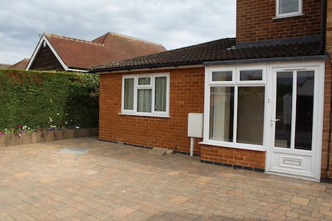 Self contained ground floor annexe in large house.