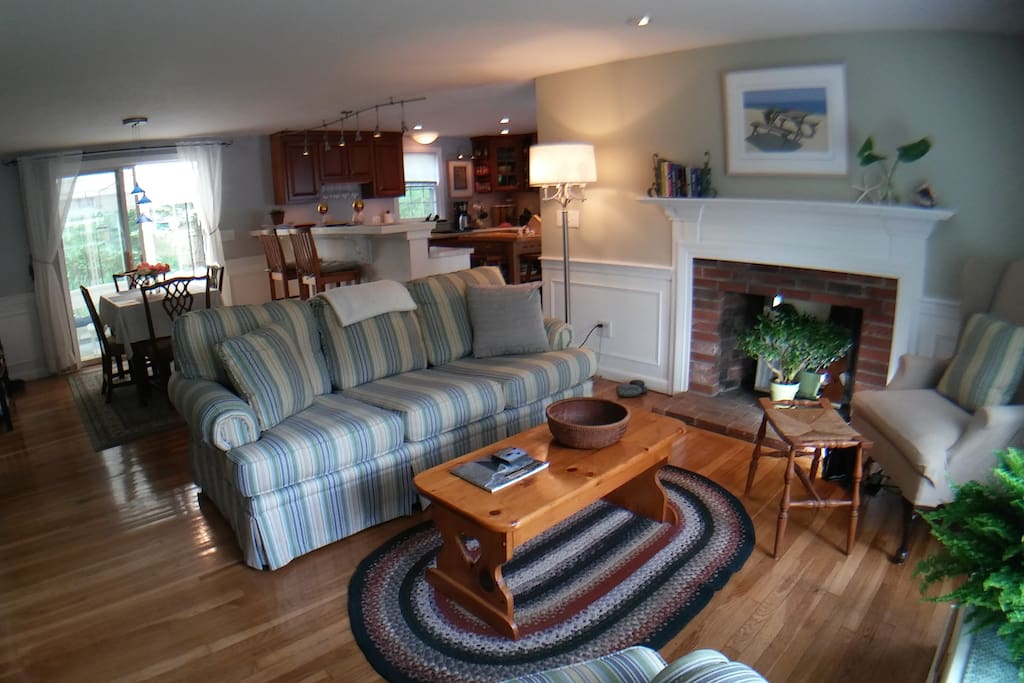 You are greeted by the simple, humble open floor plan with gleaming hardwood floors, comfortable furnishings and multitude of local, handmade artworks - for instance, the braided rag rug was made by Ginne's Mom, a longtime Provincetown resident. Our cranberry scoop magazine rack was made by my Dad, a Provincetown native (Yup, we're natives).