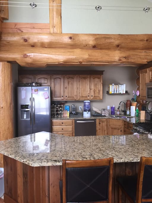 Modern with stone counters, Frigidaire appliances. Includes dishwasher, garbage disposal, nesspresso coffee machine, ninja blender and top of the line cookware necessary to make a gourmet meal. It also includes two grills and a Nikken water filter.