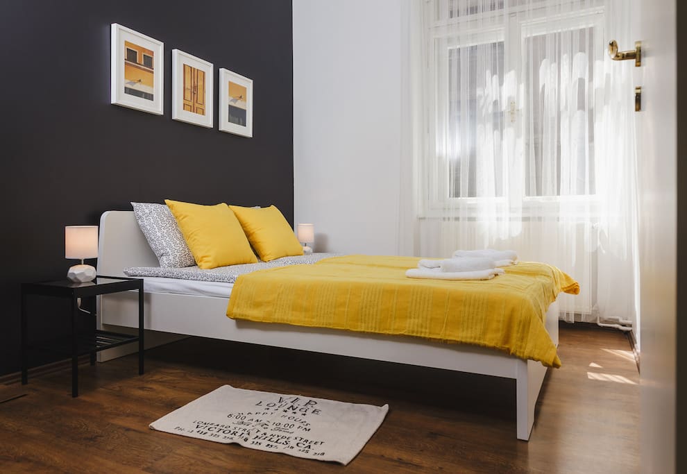 Yellow bedroom with a double bed
