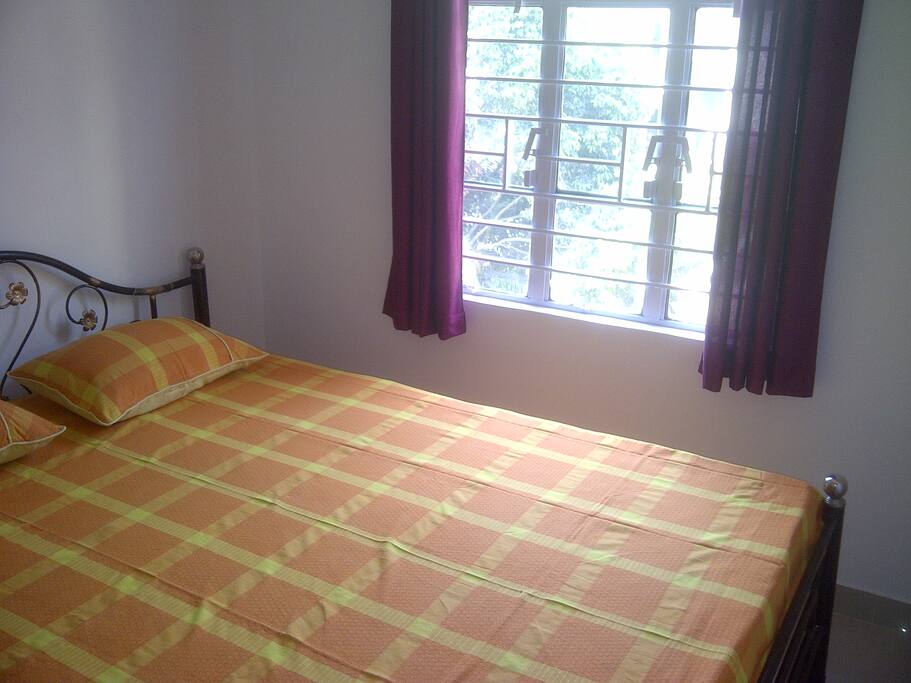 Bedroom 1 with attached toilet and AC