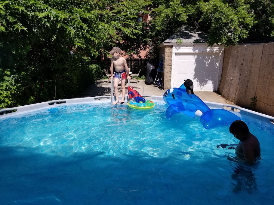 Our Back yard with round swimming pool.