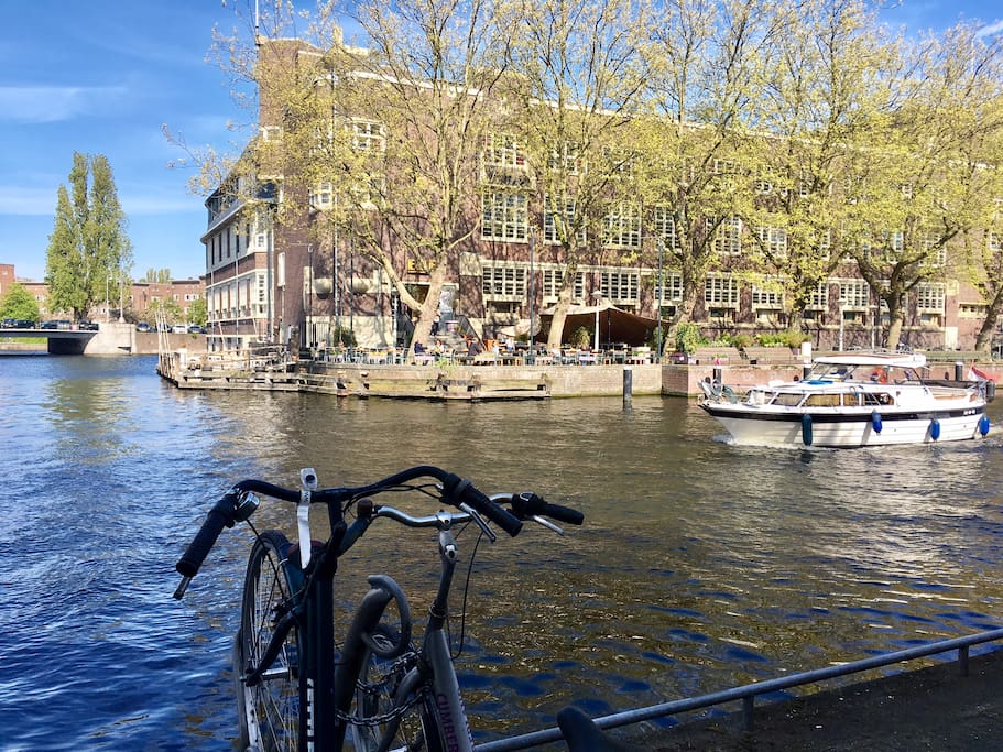 Water view with sunny terrace across the water to have a drink or lunch.