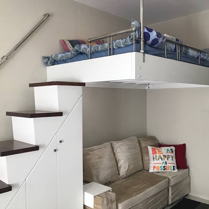 5'5 height from floor to bed with a 3-seater couch below.