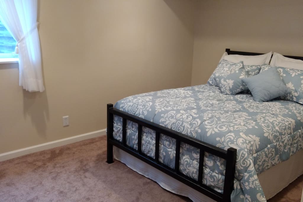 Comfortable queen bed, walk-in closet with mini fridge.