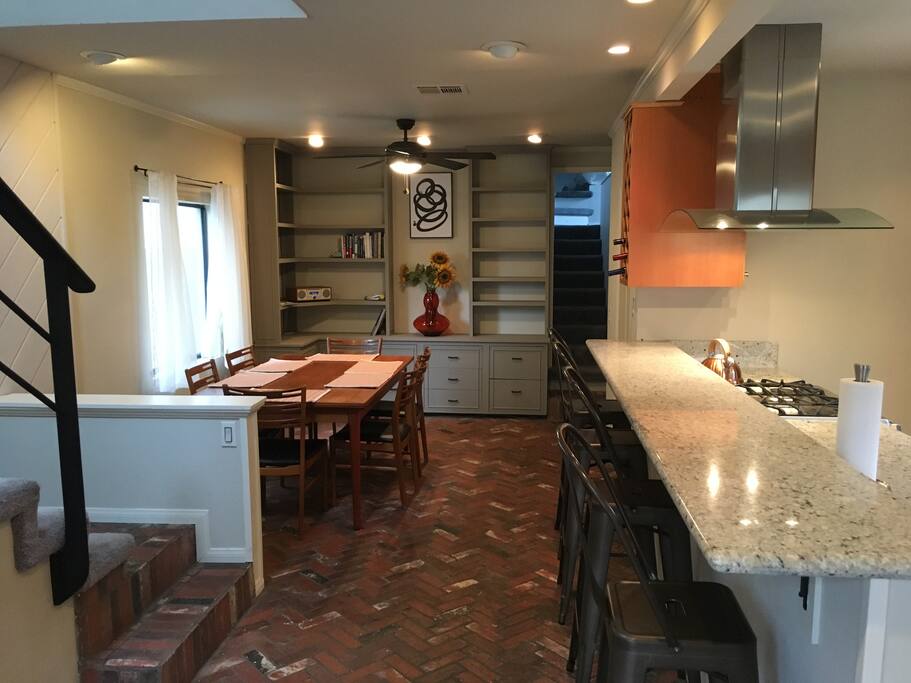 Through the front door is the kitchen and dining room. Dining room table can seat up to 8 people with the leaves out.