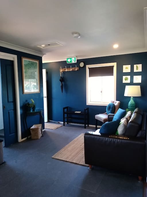 Bathroom entry, sitting area and apartment entry/exit