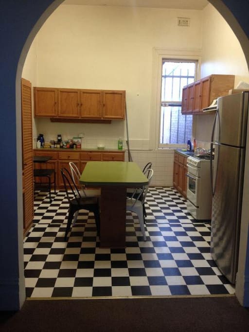 Large spacious kitchen, complete with over, stove, fridge, microwave and dining table