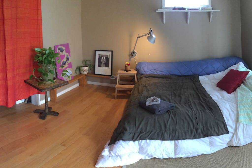 the guest room has a very comfortable queen-sized bed and lots of natural light