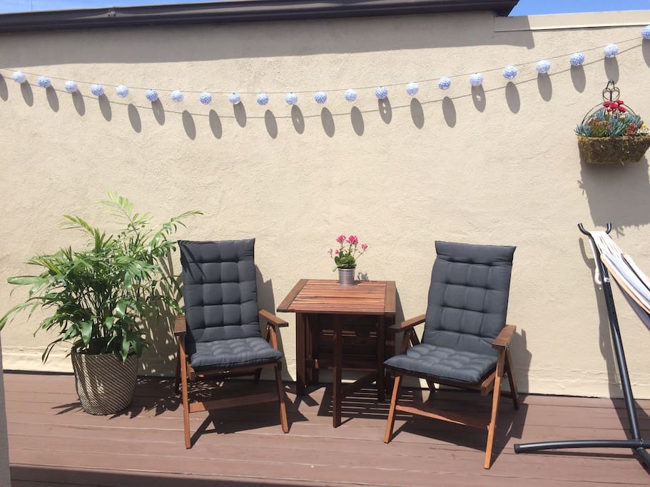 Read a book or have some tea while enjoying the day's sunlight in a cushioned reclining chair.