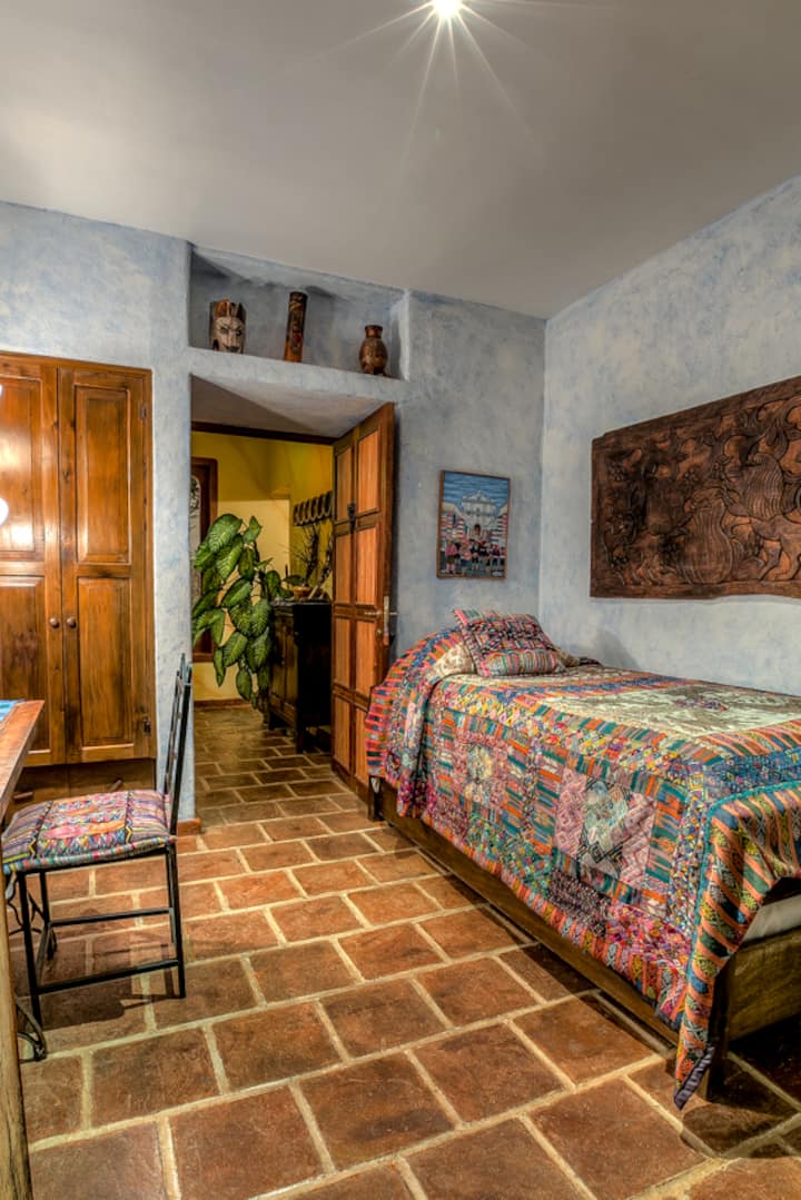 this bedroom has one twin size bed and a trundle bed (located on caster wheels underneath the twin size bed which appears in this photo)