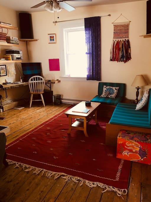 The living room. This couch turns into a Queen bed if needed.