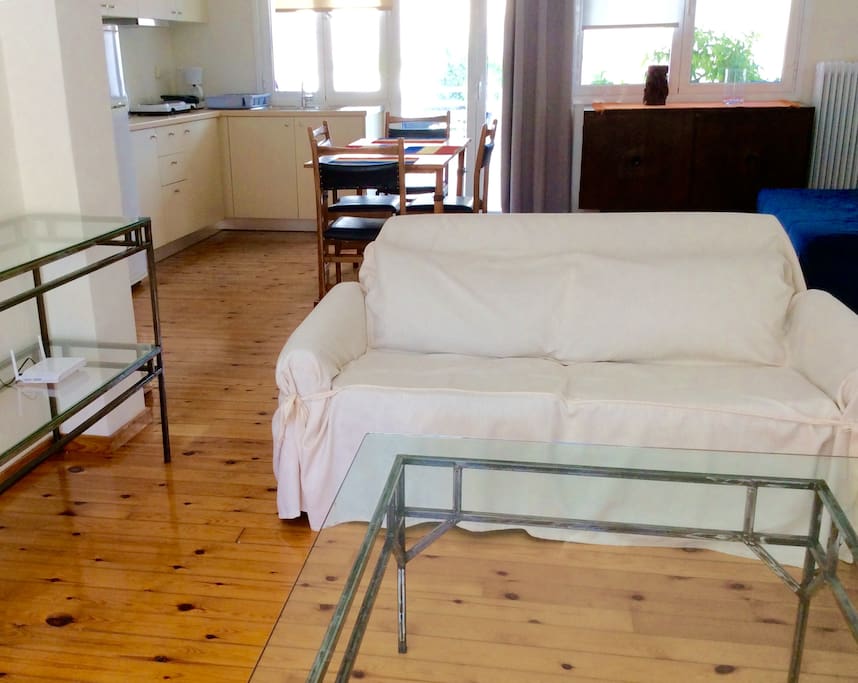 The living room and the kitchen at the back