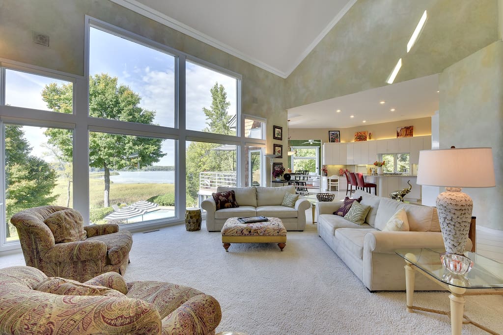 Comfortable living room--open floor plan and fabulous views of lake and pool