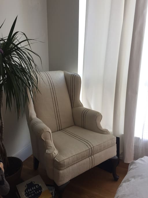 Chair in the room by the huge window