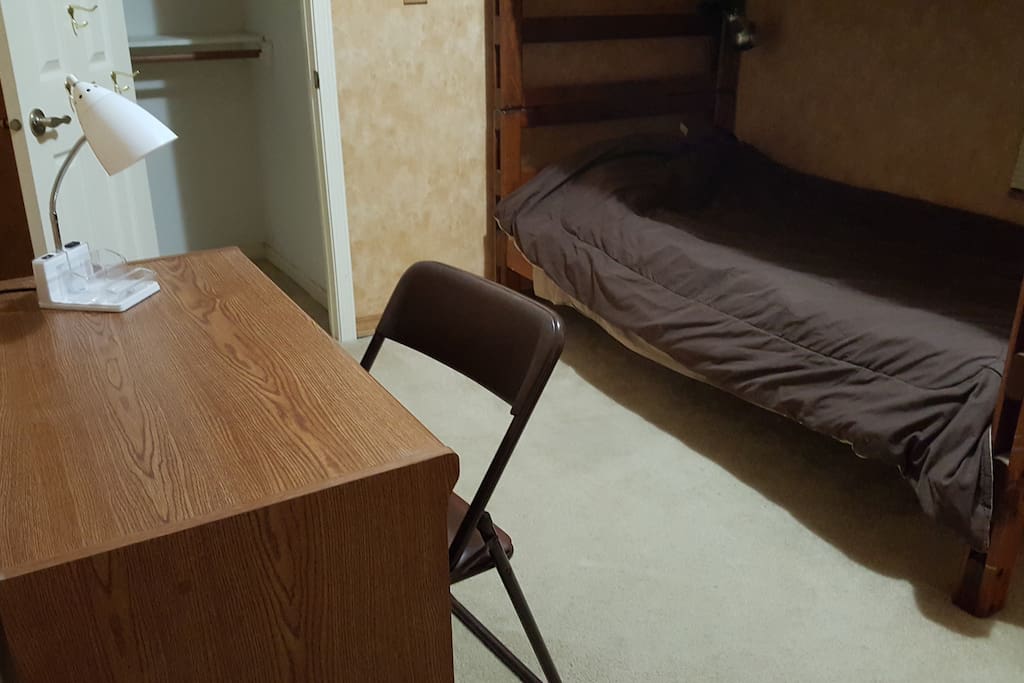 Comfy bed with desk, chair and lamp