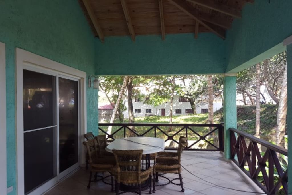 Huge 1500 sq ft balcony with dinner table and beach chairs.