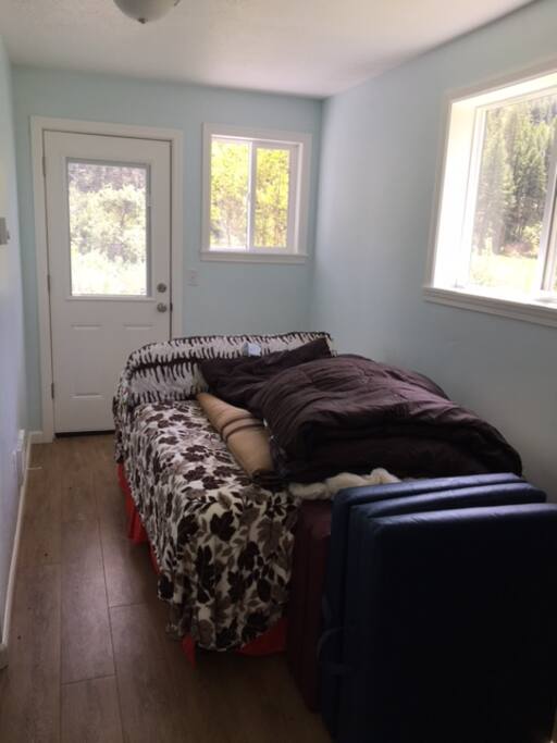 Bedroom 1 with 2 sleeping pads and sleeping bags.