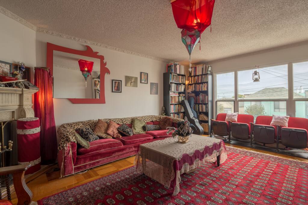 Living room with movie seating and big screen projector.