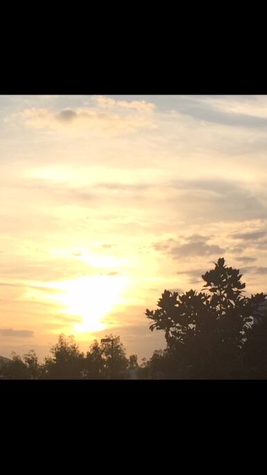 view of sunset from front of the house