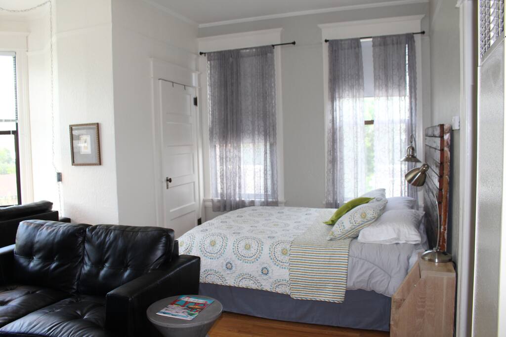 Large open space with queen bed for sleeping comfort.