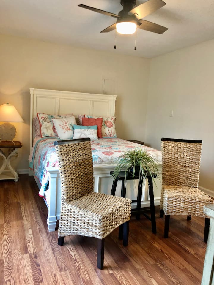 Cozy and comfortable bedroom with queen size bed, night stands  w/lamps for reading and extra sitting area. 