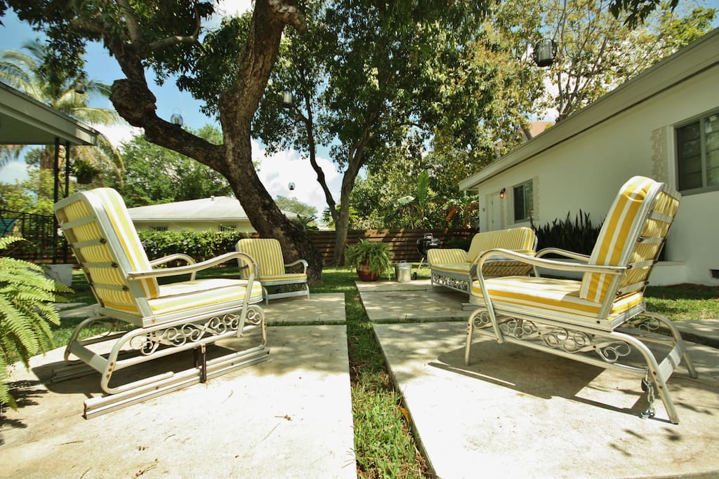 Backyard patio and grill area featuring vintage set of patio furnishings