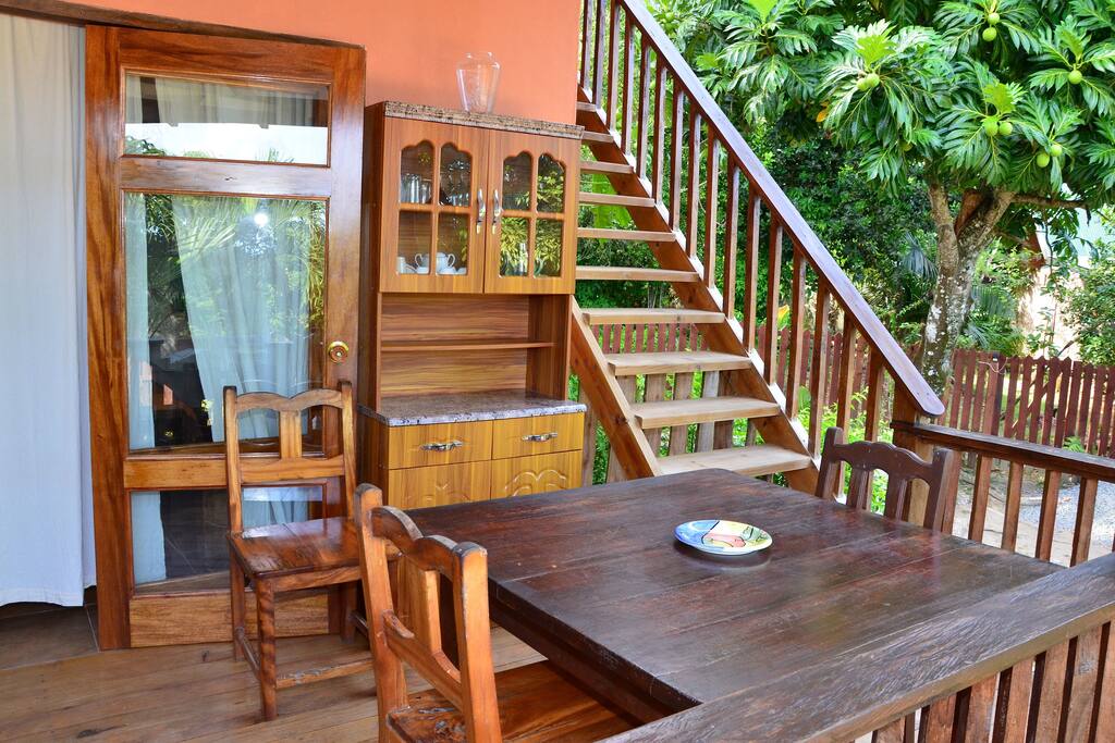 Outdoor dining space and the steps going up to the room upstairs