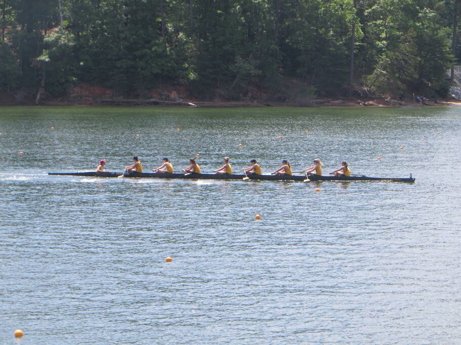 View of rowers from dock